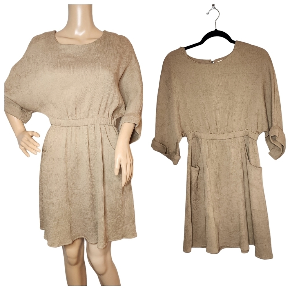 Flawless tan dress with pockets. Stretch waist.  3/4 sleeve. Crinkle fabric.  M